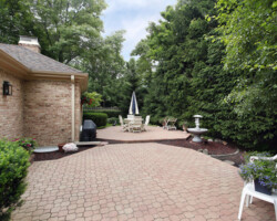 Brick patio with rock garden and fountain